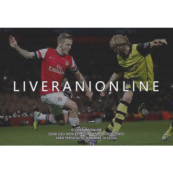 (131023) -- LONDON, Oct. 23, 2013 () --Jack Wilshere(L) of Arsenal FC vies with Marcel Schmelzer of Borussia Dortmund during the UEFA Champions League Group F match between Arsenal FC and Borussia Dortmund at Emirates Stadium in London, Britain on Oct. 22, 2013. Arsenal lost 1-2.(/Wang Lili) ©PHOTOSHOT/AGENZIA ALDO LIVERANI SAS - ITALY ONLY - Arsenal v Borussia Dortmund UEFA Champions League Group F 22 ottobre 2013