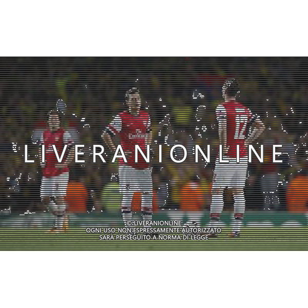 (131023) -- LONDON, Oct. 23, 2013 () -- Mesut Ozil(C) and Olivier Giroud(R) of Arsenal FC react after Robert Lewandowski of Borussia Dortmund scores during the UEFA Champions League Group F match between Arsenal FC and Borussia Dortmund at Emirates Stadium in London, Britain on Oct. 22, 2013. Arsenal lost 1-2.(/Wang Lili) ©PHOTOSHOT/AGENZIA ALDO LIVERANI SAS - ITALY ONLY - Arsenal v Borussia Dortmund UEFA Champions League Group F 22 ottobre 2013