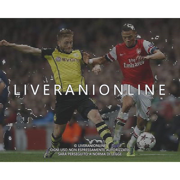 (131023) -- LONDON, Oct. 23, 2013 () -- Kieran Gibbs(R) of Arsenal FC vies with Jakub Blaszczykowski of Borussia Dortmund during the UEFA Champions League Group F match between Arsenal FC and Borussia Dortmund at Emirates Stadium in London, Britain on Oct. 22, 2013. Arsenal lost 1-2.(/Wang Lili) ©PHOTOSHOT/AGENZIA ALDO LIVERANI SAS - ITALY ONLY - Arsenal v Borussia Dortmund UEFA Champions League Group F 22 ottobre 2013