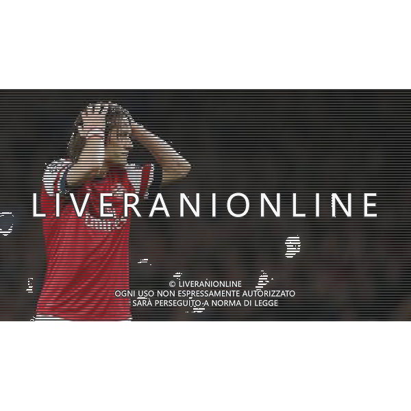 (131023) -- LONDON, Oct. 23, 2013 () -- Tomas Rosicky of Arsenal FC reacts after missing a goal during the UEFA Champions League Group F match between Arsenal FC and Borussia Dortmund at Emirates Stadium in London, Britain on Oct. 22, 2013. Arsenal lost 1-2.(/Wang Lili) ©PHOTOSHOT/AGENZIA ALDO LIVERANI SAS - ITALY ONLY - Arsenal v Borussia Dortmund UEFA Champions League Group F 22 ottobre 2013