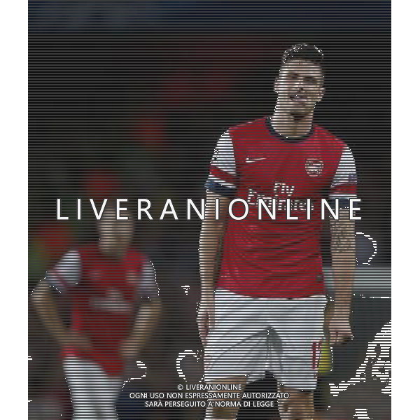 (131023) -- LONDON, Oct. 23, 2013 () -- Olivier Giroud(R) of Arsenal FC reacts during the UEFA Champions League Group F match between Arsenal FC and Borussia Dortmund at Emirates Stadium in London, Britain on Oct. 22, 2013. Arsenal lost 1-2.(/Wang Lili) ©PHOTOSHOT/AGENZIA ALDO LIVERANI SAS - ITALY ONLY - Arsenal v Borussia Dortmund UEFA Champions League Group F 22 ottobre 2013