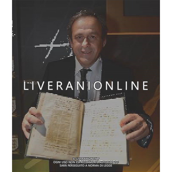 UEFA President Michel Platini poses with the original FA Minute Book from 1863 featuring the first laws of the game during the FA150 Gala Dinner commemorating the Football Association\'s 150th year at the Grand Connaught Rooms on October 26, 2013 in London, England. ©photoshot/AGENZIA ALDO LIVERANI SAS - ITALY ONLY - Cena di gala per celebrare il 150mo Anniversario della Federcalcio al Grand Connaught Rooms di Londra