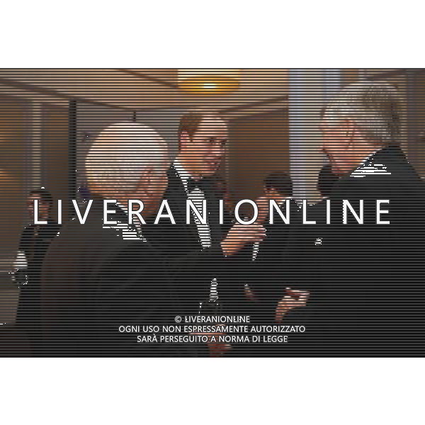 FA President Prince William, Duke of Cambridge talks with ex-England player Martin Peters and FA Chairman Greg Dyke during the FA150 Gala Dinner commemorating the Football Association\'s 150th year at the Grand Connaught Rooms on October 26, 2013 in London, England. ©photoshot/AGENZIA ALDO LIVERANI SAS - ITALY ONLY - Cena di gala per celebrare il 150mo Anniversario della Federcalcio al Grand Connaught Rooms di Londra