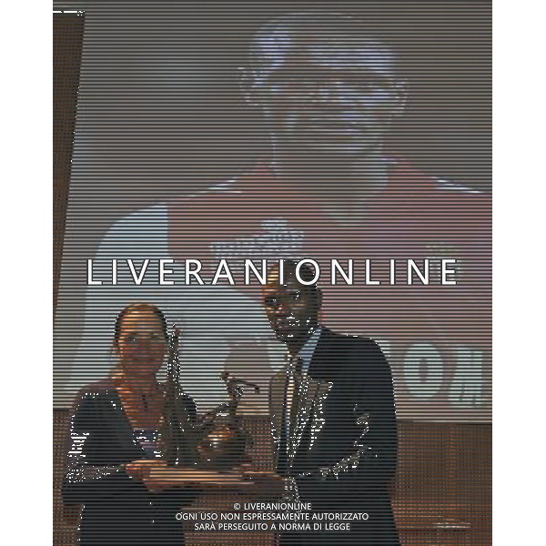 XIII Premio Giacinto Facchetti Gazzetta dello Sport \'Il Bello del Calcio\' Milano - 04.11.2013 Nella Foto:Abidal premiato dalla signora facchetti /Ph.Vitez-Ag. Aldo Liverani