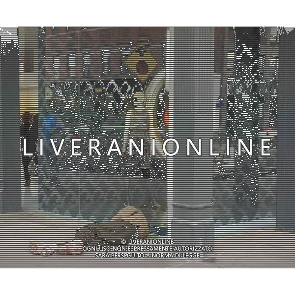 Homeless man sleeping on the sidewalk in front of the Diane Von Furstenberg store in the trendy Meatpacking District in New York on Saturday, November 2, 2013. New York Mayoral candidate Joe Lhota has based his campaign on the premise that if his opponent Bill De Blasio is elected New York will return to the \'bad old days\'. ©photoshot/AGENZIA ALDO LIVERANI SAS - ITALY ONLY - Vedute della citta\' di New York
