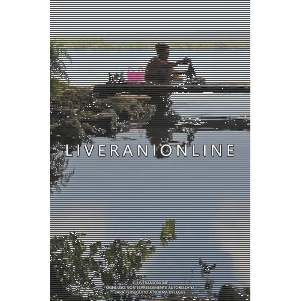 (131108) -- EAST RENNELL, Nov. 8, 2013 () -- Photo taken on Oct.30, 2013 shows a woman washing clothes by the Lake Tegano in East Rennell of Solomon Islands. East Rennell, the largest raised coral atoll in the world, was listed as an endangered world heritage by UNESCO in 2013. (/Gao Jianjun) ©Photoshot/Ag. Aldo Liverani s.a.s.-Only Italy-Editorial Use Only