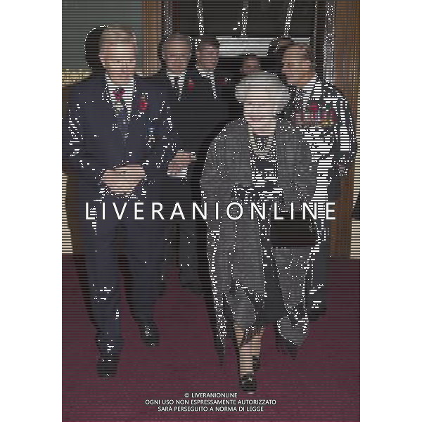 The Queen and The Duke of Edinburgh arrive at the annual Royal British Legion Festival of Remembrance. The Queen is accompanied (to the left) by Vice President of the British Legion Vice Admiral Peter Wilkinson CB CVO in the Royal Festival Hall, London on the 9th November 2013 ©photohsot/AGENZIA ALDO LIVERANI SAS - ITALY ONLY - EDITORIAL USE ONLY ©photoshot/AGENZIA ALDO LIVERANI SAS - ITALY ONLY - EDITORIAL USE ONLY - REALI INGLESI: La Regina Elisabetta II d\'Inghilterra e il marito Filippo Duca di Edimburgo arrivano durante l\'annuale Royal British Legion Festival of Remembrance a Londra