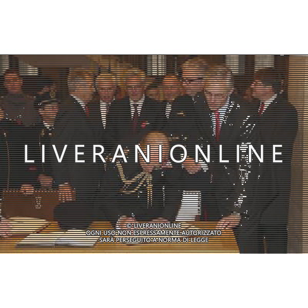 YPRES, BELGIUM - NOVEMBER 11: Prince Philip, Duke of Edinburgh signs the Gilden Book at the Townhall on November 11, 2013 in Ypres, Belgium. ©photoshot/AGENZIA ALDO LIVERANI SAS - ITALY ONLY - EDITORIAL USE ONLY - REALI INGLESI: Filippo Duca di Edimburgo al Municipio di Ypres, in Belgio 11 Novembre 2013