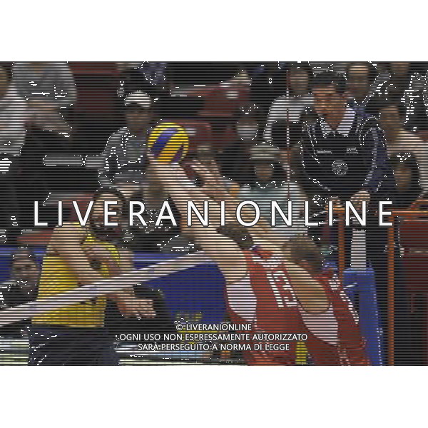(131123) -- TOKYO, Nov. 23, 2013 () -- Mauricio Borges Almeida Silva (1st, L) of Brazil spikes the ball during the FIVB World Grand Champions Cup 2013 against Russia at Tokyo Metlopolitan Gymnasium in Tokyo, Japan, Nov. 23, 2013. Russia won 3-2. (/Stringer) AG ALDO LIVERANI SAS ONLY ITALY