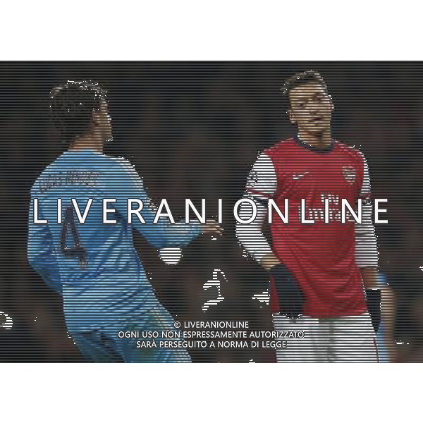 (131127) -- LONDON, Nov. 27, 2013 () -- Mesut Ozil (R) of Arsenal looks dejected after missing his first-half penalty during the UEFA Champions League Group F match between Arsenal and Marseille at Emirates Stadium in London, Britain on Nov. 26, 2013. Arsenal won 2-0.(/Wang Lili) ©PHOTOSHOT/AGENZIA ALDO LIVERANI SAS - ITALY ONLY - ARSENAL VS MARSIGLIA partita di UEFA Champions League Gruppo F allo stadio Emirates Stadium di Londra, Gran Bretagna il 26 novembre 2013. L\'Arsenal ha vinto 2-0.
