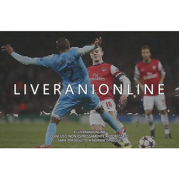 (131127) -- LONDON, Nov. 27, 2013 () -- Jack Wilshere (R) of Arsenal vies with Kassim Abdallah of Marseille during the UEFA Champions League Group F match at Emirates Stadium in London, Britain on Nov. 26, 2013. Arsenal won 2-0.(/Wang Lili) ©PHOTOSHOT/AGENZIA ALDO LIVERANI SAS - ITALY ONLY - ARSENAL VS MARSIGLIA partita di UEFA Champions League Gruppo F allo stadio Emirates Stadium di Londra, Gran Bretagna il 26 novembre 2013. L\'Arsenal ha vinto 2-0.