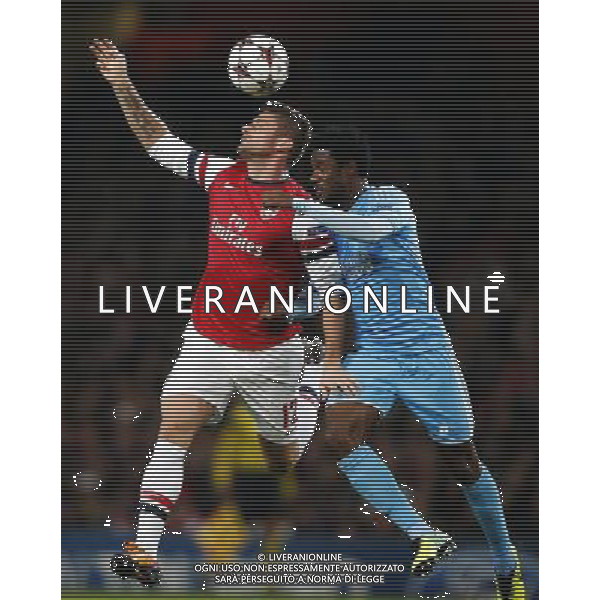 (131127) -- LONDON, Nov. 27, 2013 () -- Olivier Giroud (L) of Arsenal vies with Nicolas N\'Koulou of Marseille during the UEFA Champions League Group F match at Emirates Stadium in London, Britain on Nov. 26, 2013. Arsenal won 2-0.(/Wang Lili) ©PHOTOSHOT/AGENZIA ALDO LIVERANI SAS - ITALY ONLY - ARSENAL VS MARSIGLIA partita di UEFA Champions League Gruppo F allo stadio Emirates Stadium di Londra, Gran Bretagna il 26 novembre 2013. L\'Arsenal ha vinto 2-0.