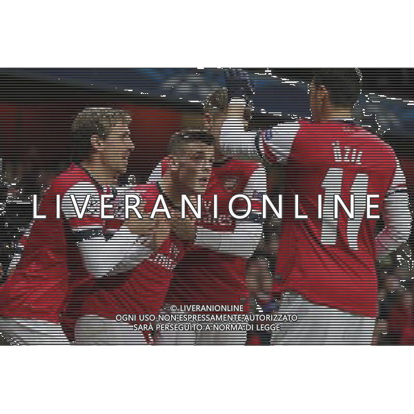 (131127) -- LONDON, Nov. 27, 2013 () -- Jack Wilshere (2nd L) of Arsenal celebrates his first goal with teammates Nacho Monreal(1st L), Aaron Ramsey (2nd R) and Mesut Ozil during the UEFA Champions League Group F match between Arsenal and Marseille at Emirates Stadium in London, Britain on Nov. 26, 2013. Arsenal won 2-0.(/Wang Lili) ©PHOTOSHOT/AGENZIA ALDO LIVERANI SAS - ITALY ONLY - ARSENAL VS MARSIGLIA partita di UEFA Champions League Gruppo F allo stadio Emirates Stadium di Londra, Gran Bretagna il 26 novembre 2013. L\'Arsenal ha vinto 2-0.