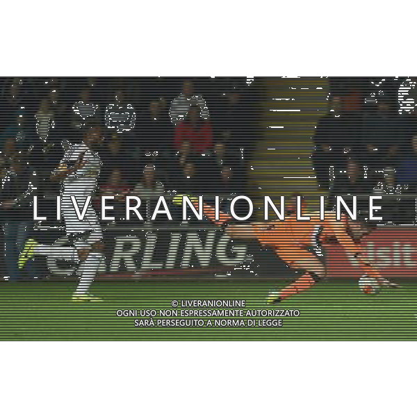 Valencia\'s Victor Ruiz goes down after being pushed by Swansea City\'s Roland Lamah Photo by Ian Cook/CameraSport Football - UEFA Europa League Group A - Swansea City v Valencia - Thursday 28th November 2013 - The Liberty Stadium - Swansea © CameraSport - 43 Linden Ave. Countesthorpe. Leicester. England. LE8 5PG - Tel: +44 (0) 116 277 4147 - admin@camerasport.com - www.camerasport.com AG ALDO LIVERANI SAS ONLY ITALY