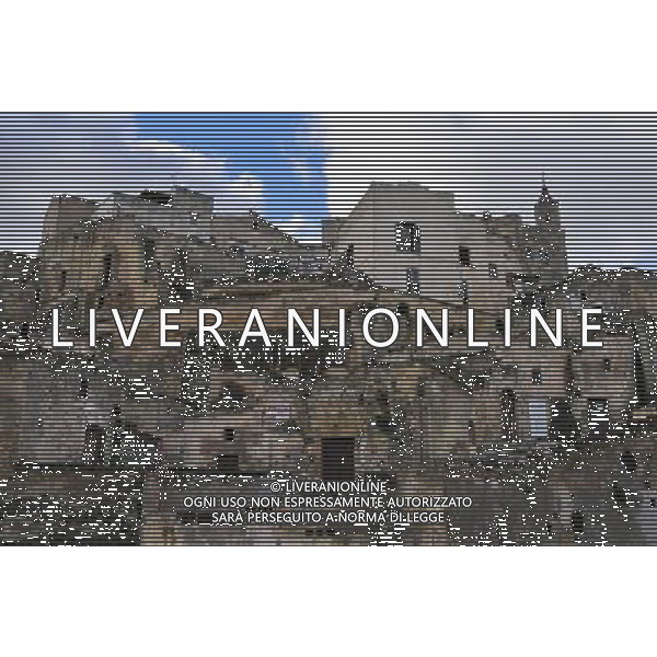 (131128) -- MATERA, Nov. 28, 2013 () -- Photo taken on Nov. 26, 2013 shows the Sassi of Matera in the southern region of Basilicata, Italy. The Sassi of Matera is the most outstanding, intact example of a troglodyte settlement in the mediterranean region, perfectly adapted to its terrain and ecosystem. The first inhabited zone dates from the Palaeolithic, while later settlements illustrate a number of significant stages in human history. The Sassi of Matera was listed as one of the UNESCO World Heritage Sites in 1993.(/Zhang Jing) AG ALDO LIVERANI SAS ONLY ITALY