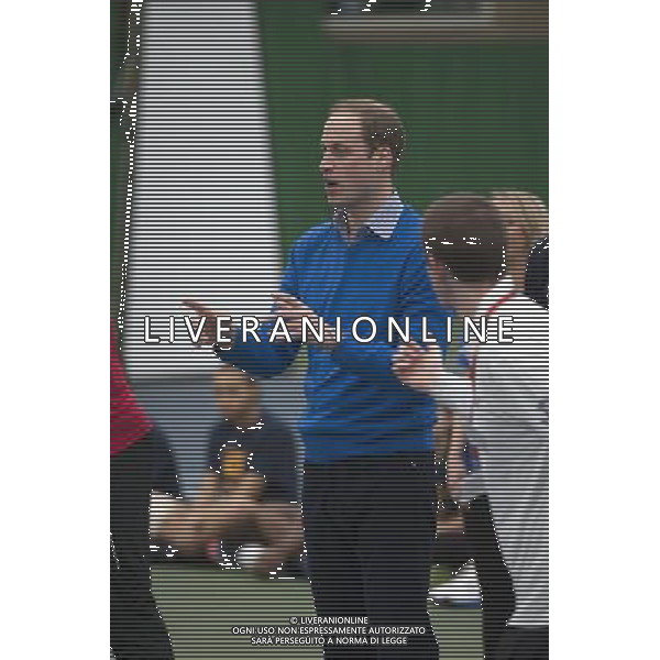 The Duke of Cambridge, as Patron of The Royal Foundation of The Duke and Duchess of Cambridge and Prince Harry, will visit a Coach Core apprentice training session at Westway Sports Centre. The Duke and Duchess of Cambridge and Prince Harry launched their Coach Core programme in July 2012 the day prior to the London Olympics. Coach Core provides an intense programme of training to 16-24 year olds, many from disadvantaged social backgrounds, to become qualified sports coaches who can inspire their peers. The project aspires to guide the apprentices into meaningful employment and enable them to commit to a sustained involvement in sports coaching in their communities. The first cohort of apprentice coaches are now nearing the end of their training and most will graduate from the project in February 2014. London ©PHOTOSHOT/AGENZIA ALDO LIVERANI SAS - ITALY ONLY - EDITORIAL USE ONLY - REALI INGLESI: Il principe William d\'inghilterra, durante un allenamento di formazione per apprendisti Allenatori al centro sportivo Westway a Londra