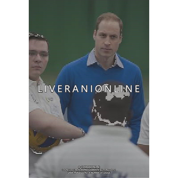 The Duke of Cambridge, as Patron of The Royal Foundation of The Duke and Duchess of Cambridge and Prince Harry, will visit a Coach Core apprentice training session at Westway Sports Centre. The Duke and Duchess of Cambridge and Prince Harry launched their Coach Core programme in July 2012 the day prior to the London Olympics. Coach Core provides an intense programme of training to 16-24 year olds, many from disadvantaged social backgrounds, to become qualified sports coaches who can inspire their peers. The project aspires to guide the apprentices into meaningful employment and enable them to commit to a sustained involvement in sports coaching in their communities. The first cohort of apprentice coaches are now nearing the end of their training and most will graduate from the project in February 2014. London ©PHOTOSHOT/AGENZIA ALDO LIVERANI SAS - ITALY ONLY - EDITORIAL USE ONLY - REALI INGLESI: Il principe William d\'inghilterra, durante un allenamento di formazione per apprendisti Allenatori al centro sportivo Westway a Londra
