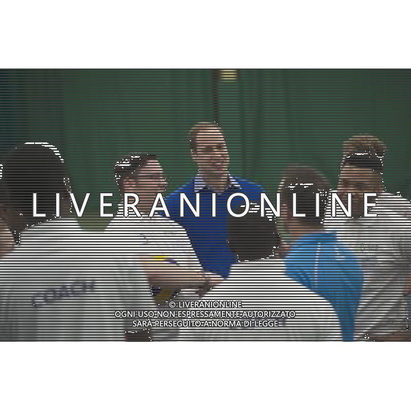 The Duke of Cambridge, as Patron of The Royal Foundation of The Duke and Duchess of Cambridge and Prince Harry, will visit a Coach Core apprentice training session at Westway Sports Centre. The Duke and Duchess of Cambridge and Prince Harry launched their Coach Core programme in July 2012 the day prior to the London Olympics. Coach Core provides an intense programme of training to 16-24 year olds, many from disadvantaged social backgrounds, to become qualified sports coaches who can inspire their peers. The project aspires to guide the apprentices into meaningful employment and enable them to commit to a sustained involvement in sports coaching in their communities. The first cohort of apprentice coaches are now nearing the end of their training and most will graduate from the project in February 2014. London ©PHOTOSHOT/AGENZIA ALDO LIVERANI SAS - ITALY ONLY - EDITORIAL USE ONLY - REALI INGLESI: Il principe William d\'inghilterra, durante un allenamento di formazione per apprendisti Allenatori al centro sportivo Westway a Londra