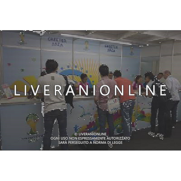 (131206) -- COSTA DO SAUIPE, Nov. 6, 2013 () -- Journalists get their accreditation cards at Sauipe Park in Costa do Sauipe, Bahia, Brazil, Nov. 5, 2013. The final draw of 2014 FIFA World Cup is scheduled to held here on Nov. 6. (/Xu Zijian) AG ALDO LIVERANI SAS ONLY ITALY