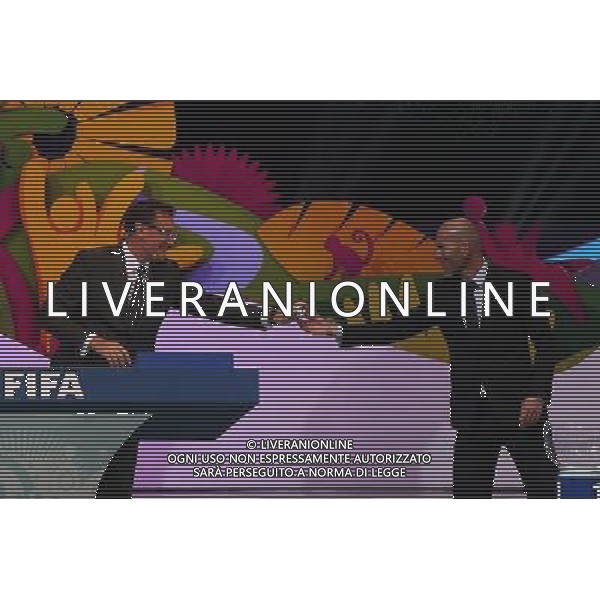 (131206) -- COSTA DO SAUIPE, Dec. 6, 2013 (Xinhua) -- FIFA General Secretary Jerome Valcke (L) receives the ballot from former French soccer player Zinedine Yazid Zidane during the final draw for the groups and matchups of the 2014 FIFA World Cup Brazil in Costa do Sauipe, Brazil, on Dec. 6, 2013. (Xinhua/Xu Zijian) AG ALDO LIVERANI SAS ONLY ITALY