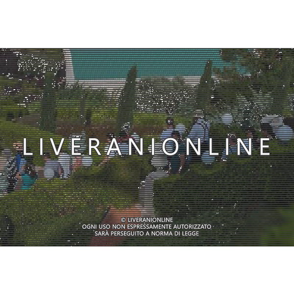 (131207) -- HAIFA (ISRAEL), Dec. 7, 2013 () -- Visitors tour the terraces of the Shrine of the Bab in Haifa, Israel, on Nov. 1, 2013. The Baha\'i Holy Places in Haifa and Western Galilee in Israel was inscribed on the UNESCO World Heritage List in 2008 for their profound spiritual meaning and the testimony they bear to the strong tradition of pilgrimage in the Baha\'i faith. The property includes the two most holy places in the Baha\'i religion associated with the founders, the Shrine of Baha\'u\'llah in Acre and the Shrine of the Bab in Haifa, together with their surrounding gardens, associated buildings and monuments. These two shrines are part of a larger complex of buildings, monuments and sites at seven distinct locations in Haifa and Western Galilee that are visited as part of the Baha\'i pilgrimage. (/Li Rui) AG ALDO LIVERANI SAS ONLY ITALY