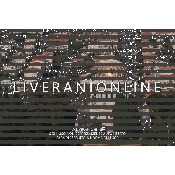 (131207) -- HAIFA (ISRAEL), Dec. 7, 2013 () -- Photo taken on Nov. 1, 2013, shows a bird flying past the Shrine of the Bab in Haifa, Israel. The Baha\'i Holy Places in Haifa and Western Galilee in Israel was inscribed on the UNESCO World Heritage List in 2008 for their profound spiritual meaning and the testimony they bear to the strong tradition of pilgrimage in the Baha\'i faith. The property includes the two most holy places in the Baha\'i religion associated with the founders, the Shrine of Baha\'u\'llah in Acre and the Shrine of the Bab in Haifa, together with their surrounding gardens, associated buildings and monuments. These two shrines are part of a larger complex of buildings, monuments and sites at seven distinct locations in Haifa and Western Galilee that are visited as part of the Baha\'i pilgrimage. (/Li Rui) AG ALDO LIVERANI SAS ONLY ITALY