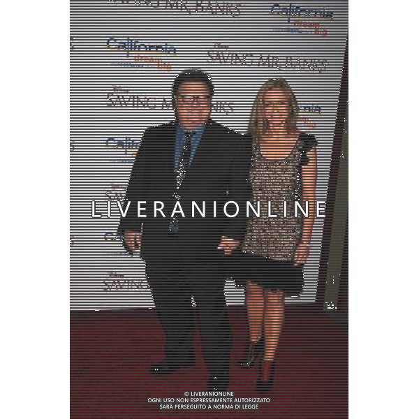 Actor Wayne Knight (L) and Clare De Chenu arrive at the \'Saving Mr. Banks\' - Los Angeles Premiere at Walt Disney Studios on December 9, 2013 in Burbank, California. ©PHOTOSHOT/AGENZIA ALDO LIVERANI SAS - ITALY ONLY - EDITORIAL USE ONLY