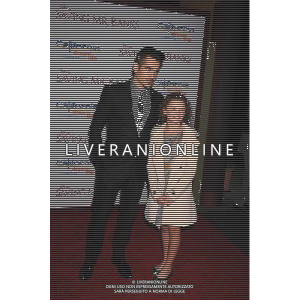 Actor Colin Farrell (L) and actress Annie Rose Buckley arrive at the \'Saving Mr. Banks\' - Los Angeles Premiere at Walt Disney Studios on December 9, 2013 in Burbank, California. ©PHOTOSHOT/AGENZIA ALDO LIVERANI SAS - ITALY ONLY - EDITORIAL USE ONLY