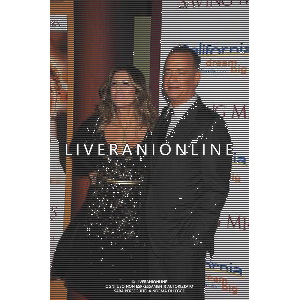 Producer Rita Wilson (L) and actor Tom Hanks arrive at the \'Saving Mr. Banks\' - Los Angeles Premiere at Walt Disney Studios on December 9, 2013 in Burbank, California. ©PHOTOSHOT/AGENZIA ALDO LIVERANI SAS - ITALY ONLY - EDITORIAL USE ONLY