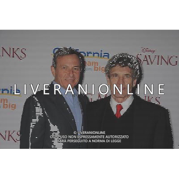 BURBANK, CA- DECEMBER 09: Chairman and CEO, The Walt Disney Company Bob Iger; (L) and Chairman of the Walt Disney Studios Alan Horn arrive at the \'Saving Mr. Banks\' - Los Angeles Premiere at Walt Disney Studios on December 9, 2013 in Burbank, California. AG ALDO LIVERANI SAS ONLY ITALY