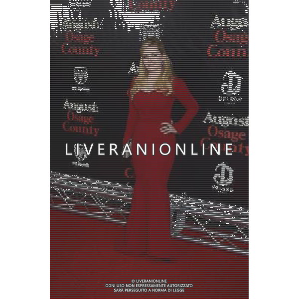 Abigail Breslin in red Zac Posen dress attends the New York Premiere of \'August: Osage County\' on December 12, 2013 at the Ziegfeld Theatre in New York City. AG ALDO LIVERANI SAS ONLY ITALY
