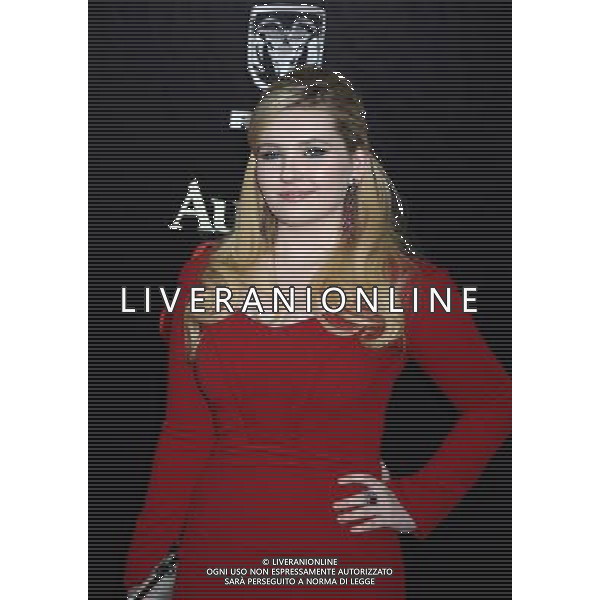 Abigail Breslin in red Zac Posen dress attends the New York Premiere of \'August: Osage County\' on December 12, 2013 at the Ziegfeld Theatre in New York City. AG ALDO LIVERANI SAS ONLY ITALY