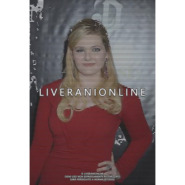 Abigail Breslin in red Zac Posen dress attends the New York Premiere of \'August: Osage County\' on December 12, 2013 at the Ziegfeld Theatre in New York City. AG ALDO LIVERANI SAS ONLY ITALY