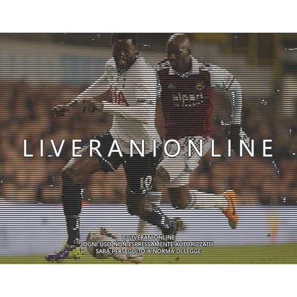Tottenham Hotspur\'s Emmanuel Adebayordespite the attentions of West Ham United\'s Alou Diarra Photo by Kieran Galvin/CameraSport Football - Capital One Cup Quarter-Final - Tottenham Hotspur v West Ham United - Wednesday 18th December 2013 - White Hart Lane - London © CameraSport - 43 Linden Ave. Countesthorpe. Leicester. England. LE8 5PG - Tel: +44 (0) 116 277 4147 - admin@camerasport.com - www.camerasport.com AG ALDO LIVERANI SAS ONLY ITALY