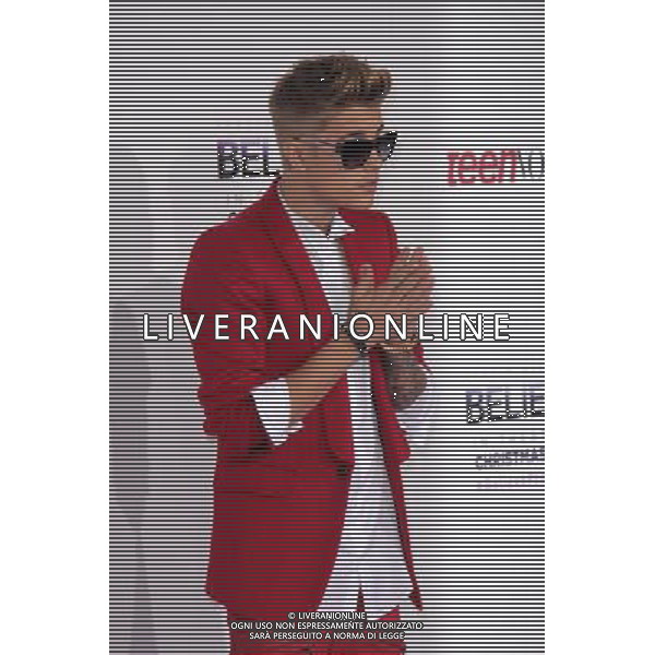 LOS ANGELES - DECEMBER 18: Justin Bieber at \'Justin Bieber\'s Believe\' Premiere on December 18 2013 in Los Angeles, California. (Photo by Martin Sloan) AG ALDO LIVERANI SAS ONLY ITALY