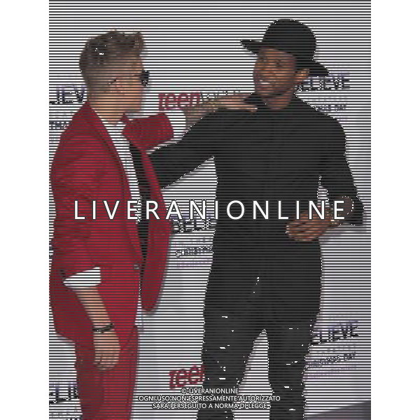 LOS ANGELES - DECEMBER 18: Justin Bieber, Usher at \'Justin Bieber\'s Believe\' Premiere on December 18 2013 in Los Angeles, California. (Photo by Martin Sloan) AG ALDO LIVERANI SAS ONLY ITALY