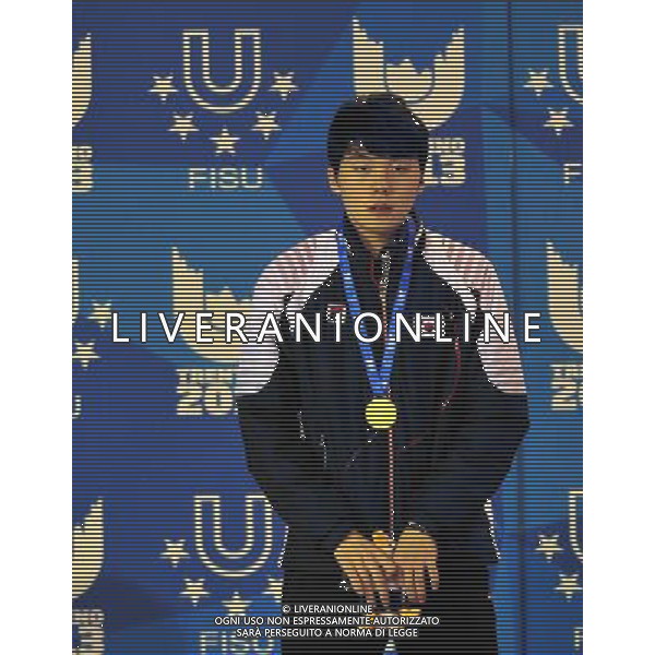 (131219) -- TRENTINO, Dec. 19, 2013 () -- Gold medallist South Korea\'s Noh Jinkyu poses for photos during the awarding ceremony of the men\'s short track 1,500m at the 26th Winter Universiade in Trentino, Italy, Dec. 18, 2013. (/He Changshan) ©PHOTOSHOT/AGENZIA ALDO LIVERANI SAS - ITALY ONLY - EDITORIAL USE ONLY