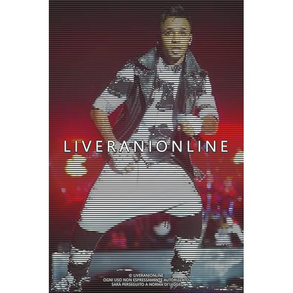 Aston Merrygold of JLS performing at the first of three shows at The O2 Arena, London, England, UK on 21st December 2013 as part of the band\'s farewell tour. The boyband consists of JB Gill, Marvin Humes, Aston Merrygold and OritsÌ© Williams. ©PHOTOSHOT/AGENZIA ALDO LIVERANI SAS - ITALY ONLY - EDITORIAL USE ONLY