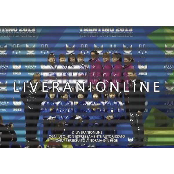 (131221) -- TRENTINO, Dec. 21, 2013 () -- Gold medallists, players of South Korea (Front), silver medallists players, of Russia (L Rear) and bronze medallists, players of Hungary pose with Claude-Louis Gallien (1st R), president of the International University Sports Federation (FISU), during the awarding ceremony of women\'s short track 3,000m relay at the 26th Winter Universiade in Trentino, Italy, Dec. 20, 2013. South Korea claimed the title with 4 minutes and 15.946 seconds. (/Bai Xuefei) ©PHOTOSHOT/AGENZIA ALDO LIVERANI SAS - ITALY ONLY - EDITORIAL USE ONLY