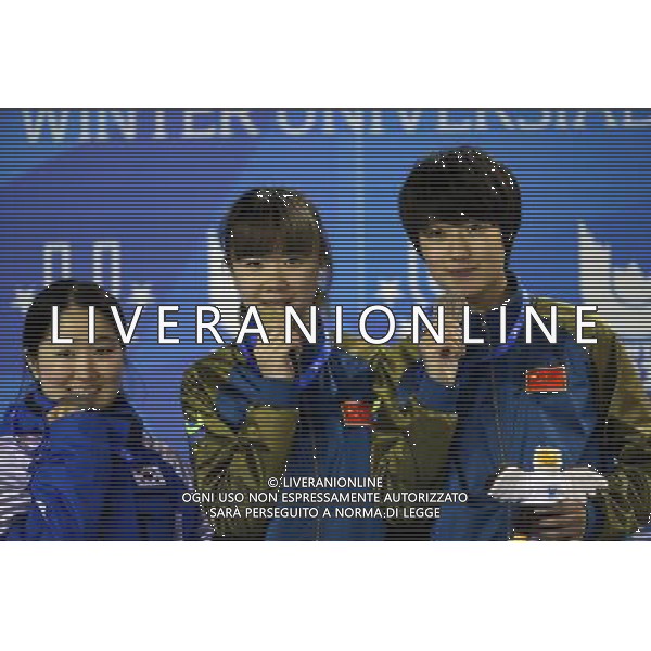 (131221) -- TRENTINO, Dec. 21, 2013 () -- Gold medallist China\'s Guo Yihan (C), silver medallist South Korea\'s Lee Eunbyul (1st L) and bronze medallist Tao Jiaying pose for photos during the awarding ceremony of the women\'s short track 1,000m at the 26th Winter Universiade in Trentino, Italy, Dec. 20, 2013. (/Bai Xuefei) ©PHOTOSHOT/AGENZIA ALDO LIVERANI SAS - ITALY ONLY - EDITORIAL USE ONLY