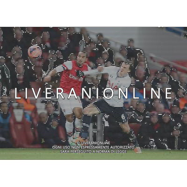 Arsenal\'s Theo Walcott despite the attentions of Tottenham Hotspur\'s Vlad Chiriche? Photo by Kieran Galvin/CameraSport Football - FA Challenge Cup Third Round - Arsenal v Tottenham Hotspur - Saturday 4th January 2014 - Emirates Stadium - London © CameraSport - 43 Linden Ave. Countesthorpe. Leicester. England. LE8 5PG - Tel: +44 (0) 116 277 4147 - admin@camerasport.com - www.camerasport.com AG ALDO LIVERANI SAS ONLY ITALY