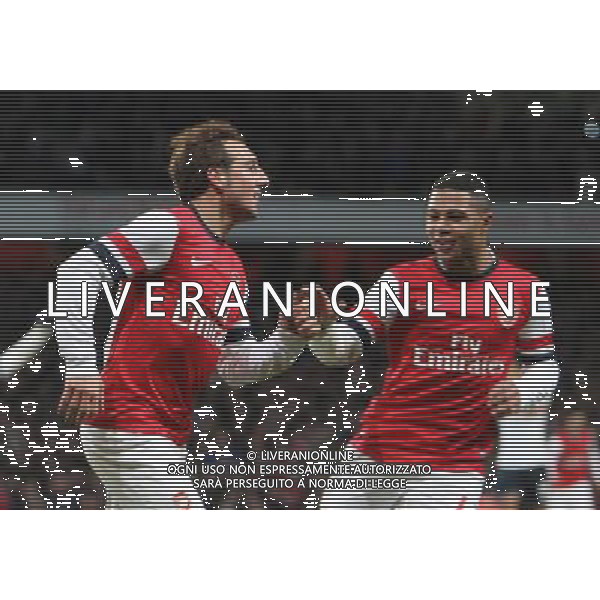 Arsenal\'s Santi Cazorla celebrates scoring his sides first goal with Arsenal\'s Serge Gnabry Photo by Kieran Galvin/CameraSport Football - FA Challenge Cup Third Round - Arsenal v Tottenham Hotspur - Saturday 4th January 2014 - Emirates Stadium - London © CameraSport - 43 Linden Ave. Countesthorpe. Leicester. England. LE8 5PG - Tel: +44 (0) 116 277 4147 - admin@camerasport.com - www.camerasport.com AG ALDO LIVERANI SAS ONLY ITALY