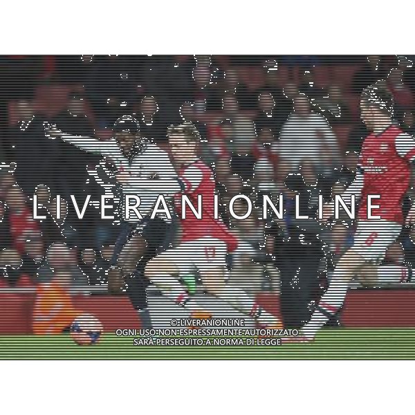 Tottenham Hotspur\'s Emmanuel Adebayor despite the attentions of Arsenal\'s Nacho Monreal Photo by Kieran Galvin/CameraSport Football - FA Challenge Cup Third Round - Arsenal v Tottenham Hotspur - Saturday 4th January 2014 - Emirates Stadium - London © CameraSport - 43 Linden Ave. Countesthorpe. Leicester. England. LE8 5PG - Tel: +44 (0) 116 277 4147 - admin@camerasport.com - www.camerasport.com AG ALDO LIVERANI SAS ONLY ITALY