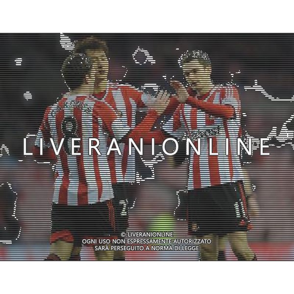 ADAM JOHNSON CELEBRATES GOAL 2.1 SUNDERLAND FC V CARLISLE UTD FC SUNDERLAND FC V CARLISLE UTD FC, FA CUP 3RD ROUND STADIUM OF LIGHT, SUNDERLAND, ENGLAND 05 January 2014 GAT77303 BARCLAYS PREMIER LEAGUE 05/01/14 WARNING! This Photograph May Only Be Used For Newspaper And/Or Magazine Editorial Purposes. May Not Be Used For Publications Involving 1 player, 1 Club Or 1 Competition Without Written Authorisation From Football DataCo Ltd. For Any Queries, Please Contact Football DataCo Ltd on +44 (0) 207 864 9121