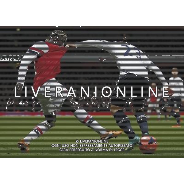 (140105) -- LONDON, Jan. 5, 2014 () -- Bacary Sagna (L) of Arsenal vies with Christian Eriksen of Tottenham Hotspur during FA Cup Third Round match between Arsenal and Tottenham Hotspur at Emirates Stadium in London, Britain on Jan. 4, 2014. Arsenal won 2-0. (/Wang Lili) FOR EDITORIAL USE ONLY. NOT FOR SALE FOR MARKETING OR ADVERTISING CAMPAIGNS. NO USE WITH UNAUTHORIZED AUDIO, VIDEO, DATA, FIXTURE LISTS, CLUBLEAGUE LOGOS OR LIVE SERVICES. ONLINE IN-MATCH USE LIMITED TO 45 IMAGES, NO VIDEO EMULATION. NO USE IN BETTING, GAMES OR SINGLE CLUBLEAGUEPLAYER PUBLICATIONS. AG ALDO LIVERANI SAS ONLY ITALY