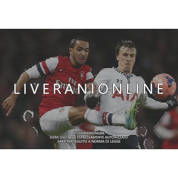 (140105) -- LONDON, Jan. 5, 2014 () -- Theo Walcott(L) of Arsenal vies with Vlad Chiriches of Tottenham Hotspur during FA Cup Third Round match between Arsenal and Tottenham Hotspur at Emirates Stadium in London, Britain on Jan. 4, 2014. Arsenal won 2-0. (/Wang Lili) FOR EDITORIAL USE ONLY. NOT FOR SALE FOR MARKETING OR ADVERTISING CAMPAIGNS. NO USE WITH UNAUTHORIZED AUDIO, VIDEO, DATA, FIXTURE LISTS, CLUBLEAGUE LOGOS OR LIVE SERVICES. ONLINE IN-MATCH USE LIMITED TO 45 IMAGES, NO VIDEO EMULATION. NO USE IN BETTING, GAMES OR SINGLE CLUBLEAGUEPLAYER PUBLICATIONS. AG ALDO LIVERANI SAS ONLY ITALY