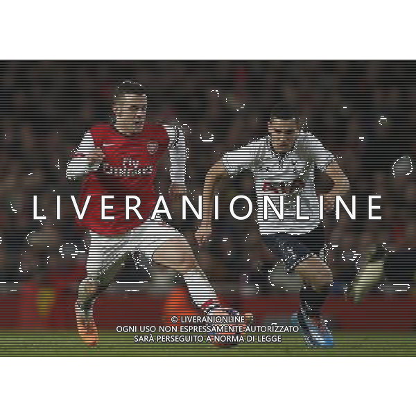 (140105) -- LONDON, Jan. 5, 2014 () -- Jack Wilshere (L) of Arsenal vies with Nabil Bentaleb of Tottenham Hotspur during FA Cup Third Round match between Arsenal and Tottenham Hotspur at Emirates Stadium in London, Britain on Jan. 4, 2014. Arsenal won 2-0. (/Wang Lili) FOR EDITORIAL USE ONLY. NOT FOR SALE FOR MARKETING OR ADVERTISING CAMPAIGNS. NO USE WITH UNAUTHORIZED AUDIO, VIDEO, DATA, FIXTURE LISTS, CLUBLEAGUE LOGOS OR LIVE SERVICES. ONLINE IN-MATCH USE LIMITED TO 45 IMAGES, NO VIDEO EMULATION. NO USE IN BETTING, GAMES OR SINGLE CLUBLEAGUEPLAYER PUBLICATIONS. AG ALDO LIVERANI SAS ONLY ITALY