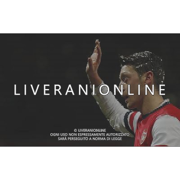 (140105) -- LONDON, Jan. 5, 2014 () -- Mesut Ozil of Arsenal greets the spectators during FA Cup Third Round match between Arsenal and Tottenham Hotspur at Emirates Stadium in London, Britain on Jan. 4, 2014. Arsenal won 2-0. (/Wang Lili) FOR EDITORIAL USE ONLY. NOT FOR SALE FOR MARKETING OR ADVERTISING CAMPAIGNS. NO USE WITH UNAUTHORIZED AUDIO, VIDEO, DATA, FIXTURE LISTS, CLUBLEAGUE LOGOS OR LIVE SERVICES. ONLINE IN-MATCH USE LIMITED TO 45 IMAGES, NO VIDEO EMULATION. NO USE IN BETTING, GAMES OR SINGLE CLUBLEAGUEPLAYER PUBLICATIONS. AG ALDO LIVERANI SAS ONLY ITALY