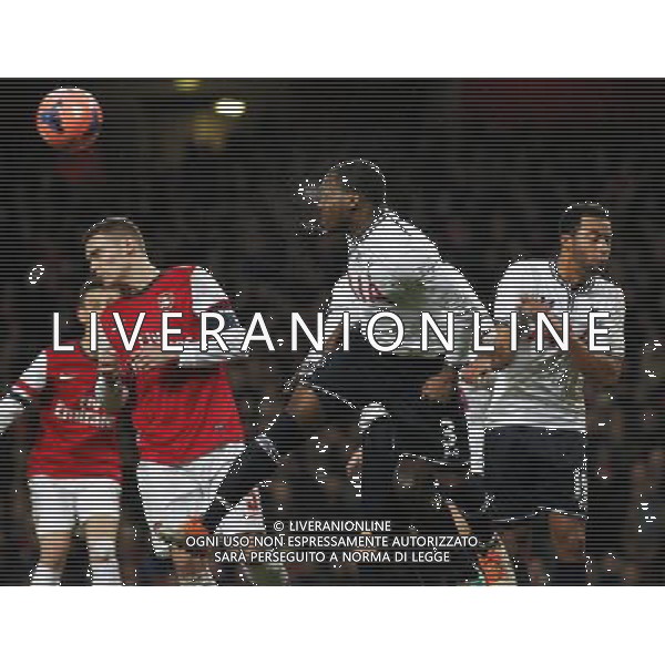 (140105) -- LONDON, Jan. 5, 2014 () -- Thomas Vermaelen (2nd L) of Arsenal vies with Danny Rose (C) of Tottenham Hotspur during FA Cup Third Round match between Arsenal and Tottenham Hotspur at Emirates Stadium in London, Britain on Jan. 4, 2014. Arsenal won 2-0. (/Wang Lili) FOR EDITORIAL USE ONLY. NOT FOR SALE FOR MARKETING OR ADVERTISING CAMPAIGNS. NO USE WITH UNAUTHORIZED AUDIO, VIDEO, DATA, FIXTURE LISTS, CLUBLEAGUE LOGOS OR LIVE SERVICES. ONLINE IN-MATCH USE LIMITED TO 45 IMAGES, NO VIDEO EMULATION. NO USE IN BETTING, GAMES OR SINGLE CLUBLEAGUEPLAYER PUBLICATIONS. AG ALDO LIVERANI SAS ONLY ITALY