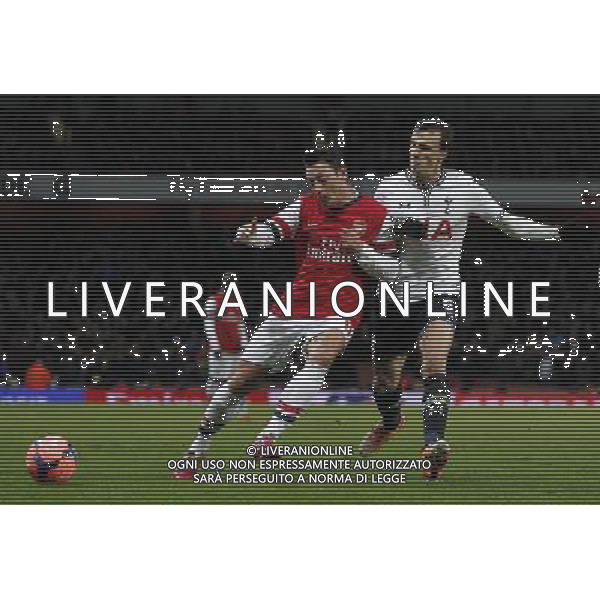(140105) -- LONDON, Jan. 5, 2014 () -- Mesut Ozil (L) of Arsenal vies with Vlad Chiriches of Tottenham Hotspur during FA Cup Third Round match between Arsenal and Tottenham Hotspur at Emirates Stadium in London, Britain on Jan. 4, 2014. Arsenal won 2-0. (/Wang Lili) FOR EDITORIAL USE ONLY. NOT FOR SALE FOR MARKETING OR ADVERTISING CAMPAIGNS. NO USE WITH UNAUTHORIZED AUDIO, VIDEO, DATA, FIXTURE LISTS, CLUBLEAGUE LOGOS OR LIVE SERVICES. ONLINE IN-MATCH USE LIMITED TO 45 IMAGES, NO VIDEO EMULATION. NO USE IN BETTING, GAMES OR SINGLE CLUBLEAGUEPLAYER PUBLICATIONS. AG ALDO LIVERANI SAS ONLY ITALY